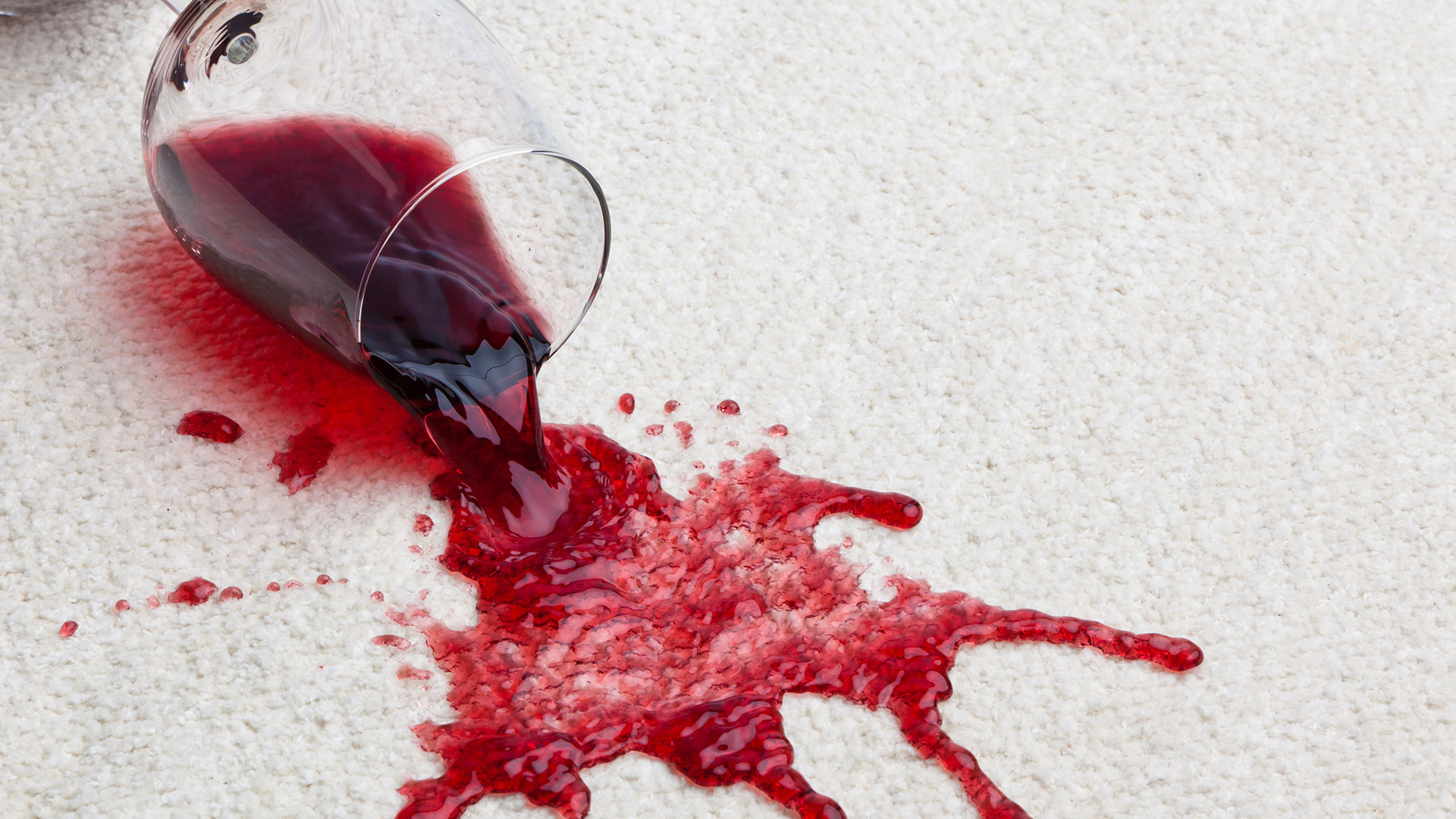 red wine spilled on light carpet