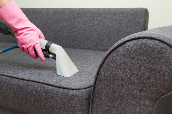 Upholstery Cleaning Services from Sharp Carpet & Air Duct person cleaning upholstery